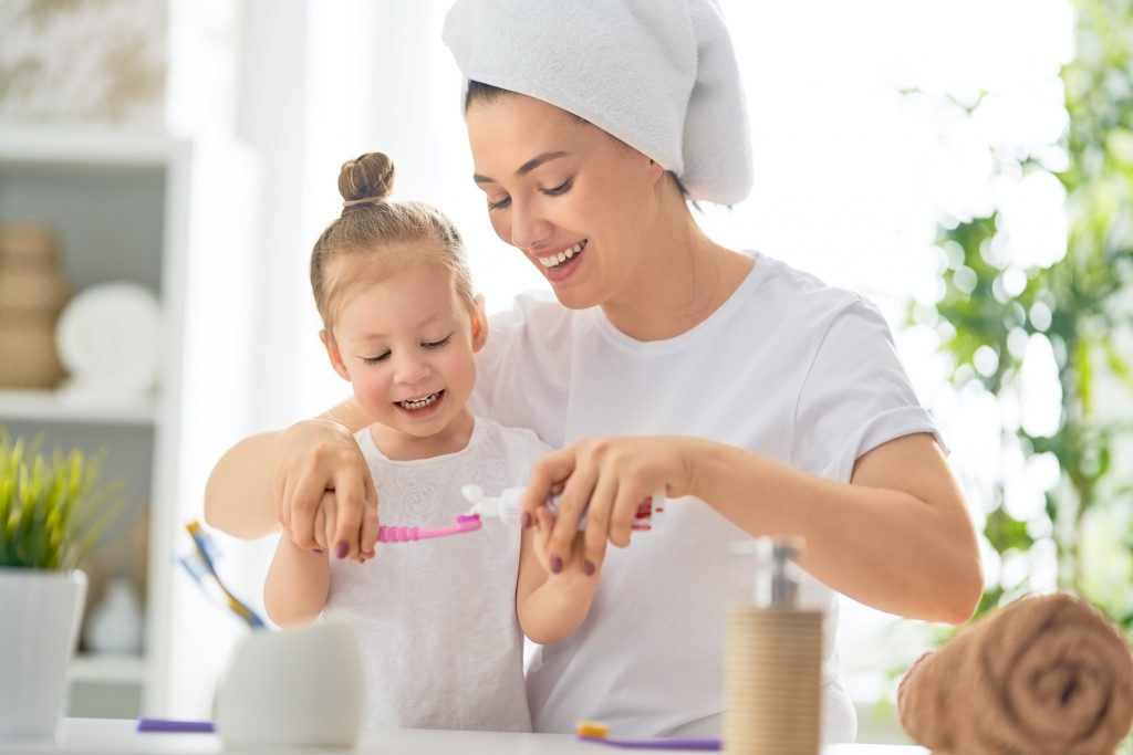 family are brushing teeth