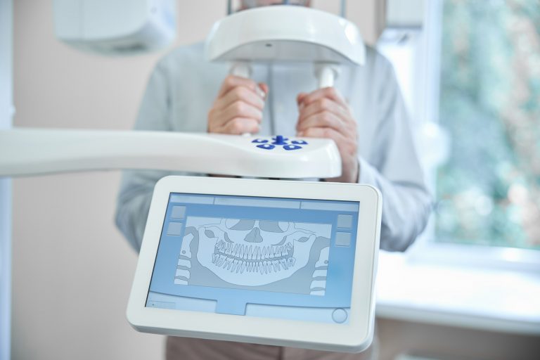 Patient of a dental clinic getting a panoramic dental x-ray